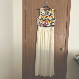 Gorgeous Ladies maxi dress with a Aztec print bodice and sheer overlay.